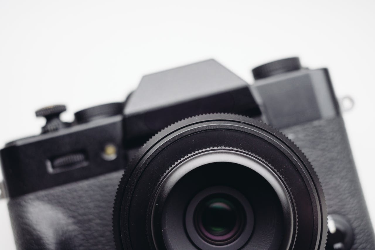 Intimate close-up view of a vintage black camera lens showcasing photographic details.