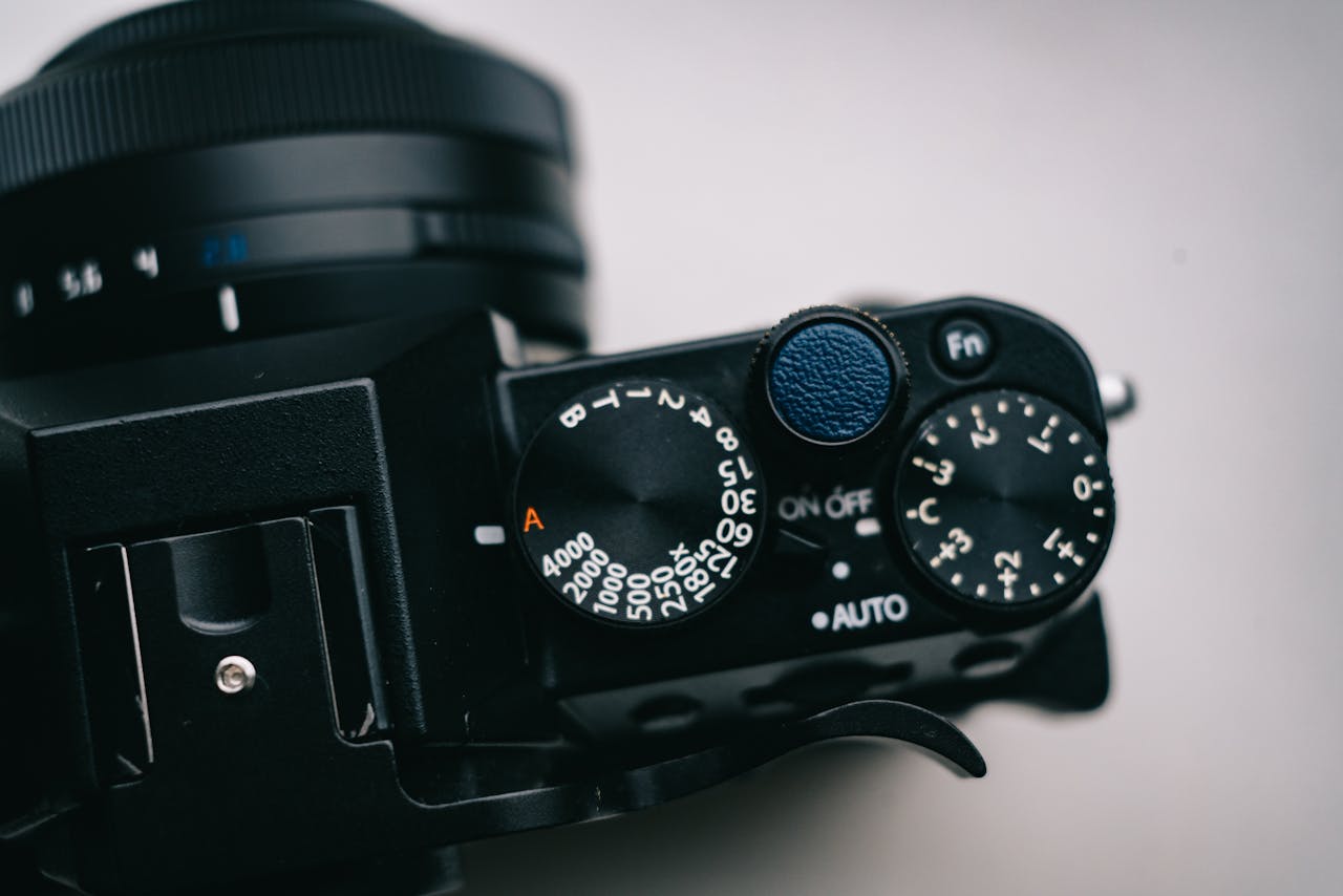 A detailed close-up shot of a cameras control dials and settings, showcasing manual adjustments.